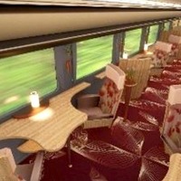 新観光列車の車内イメージ。窓に向かって配置される座席。